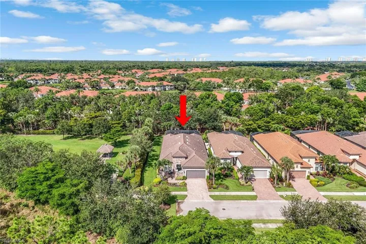 Aerial perspective of suburban area with a tree filled landscape