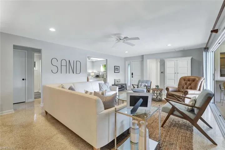 Living room featuring plenty of natural light and ceiling fan