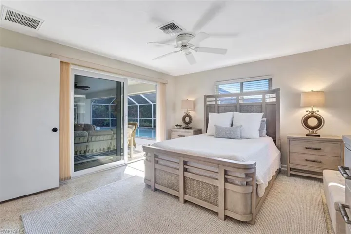 Bedroom featuring access to exterior and ceiling fan