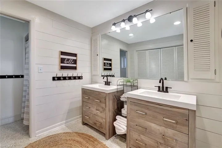 Bathroom with ship lap walls and vanity