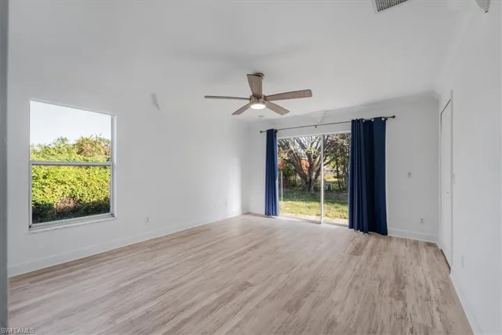 Unfurnished room with light wood-style flooring and a ceiling fan