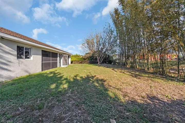 View of yard featuring a sunroom