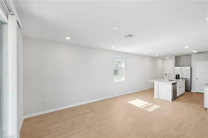 Kitchen featuring light wood-style floors, visible vents, recessed lighting, a sink, and stainless steel appliances