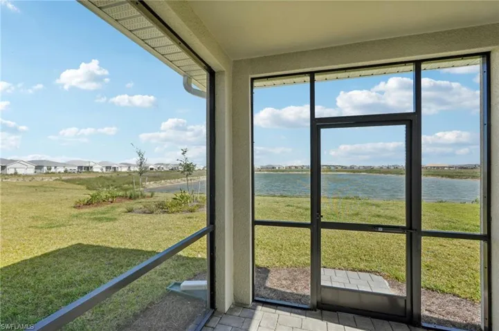 Unfurnished sunroom with a water view