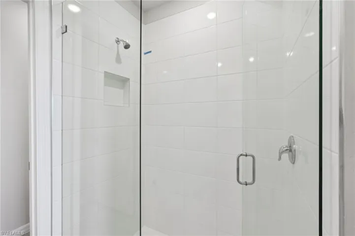 Bathroom featuring a shower stall