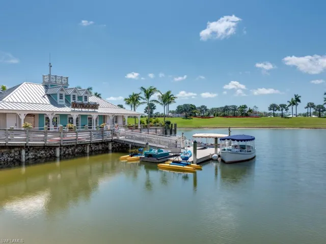 Dock with a water view and electric boats for use along with kayaks