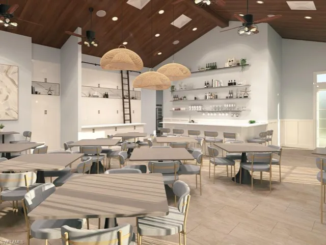 Card/hobby/meeting room with a ceiling fan, a wainscoted wall, a skylight, a high wood ceiling, and recessed lighting