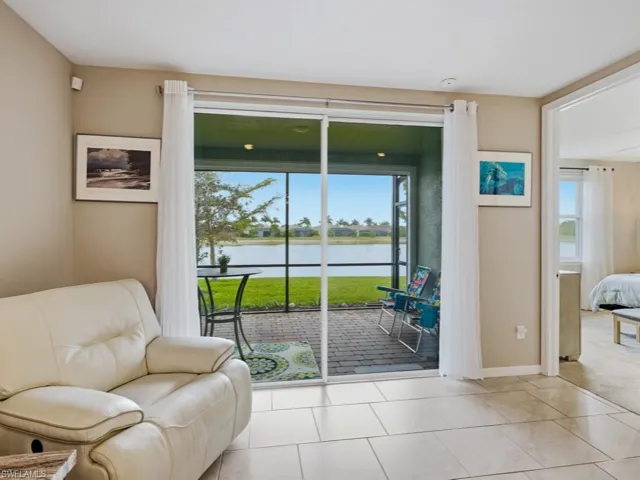 Living area featuring a water view and tile patterned floors