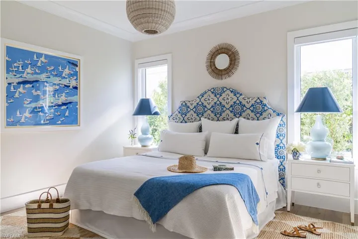 Bedroom with crown molding and wood finished floors