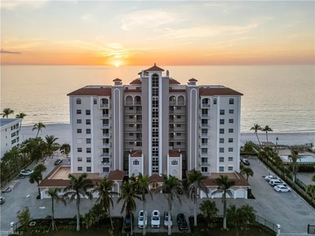 Property at dusk featuring a water view