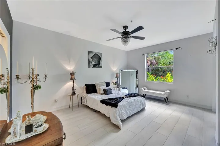 Bedroom featuring light wood-style flooring and a ceiling fan