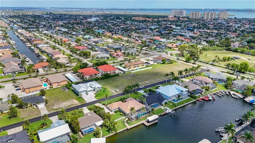 Aerial perspective showcasing a residential area with extensive canal access