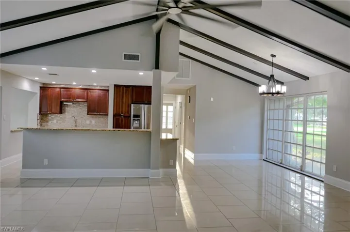Family room and dining iwith cathedral ceilings