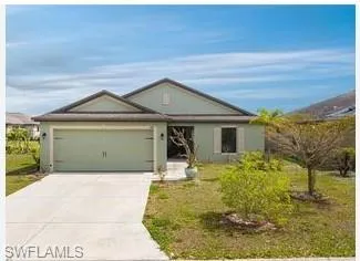 Ranch-style home featuring a garage