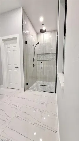 Bathroom featuring a shower with shower door