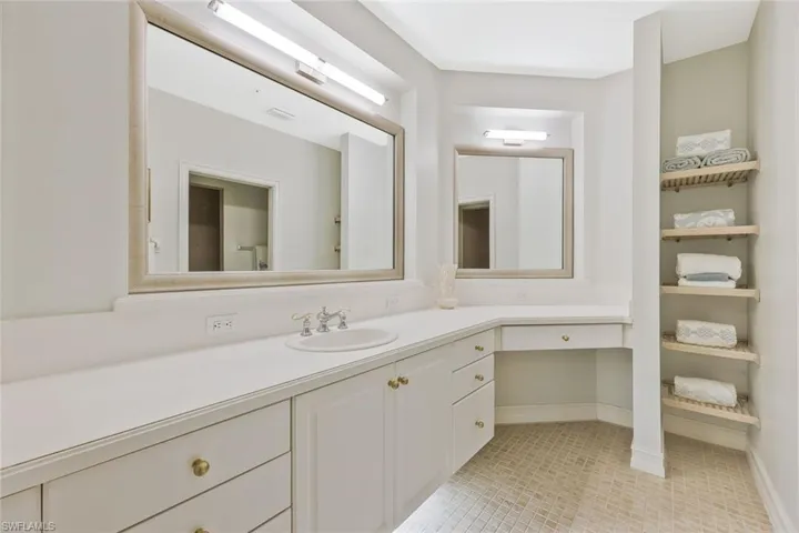 HUGE ensuite primary bathroom featuring a double vanity.