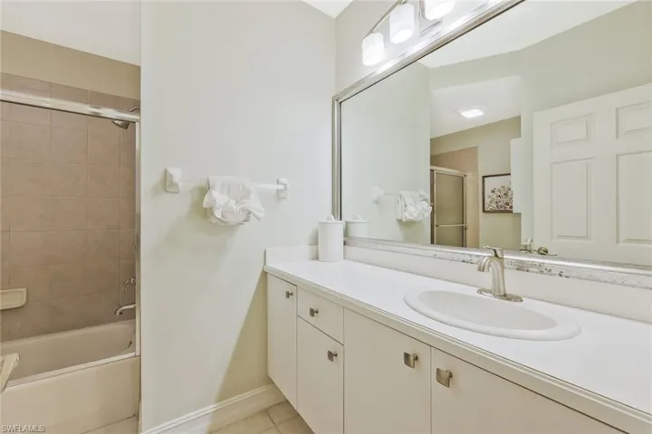 Ensuite guest bathroom features a shower and tub.