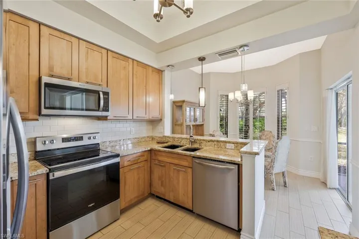 Kitchen features stainless appliances.