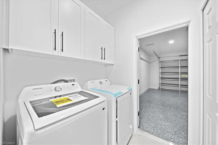 Laundry area with cabinet space and washer and dryer