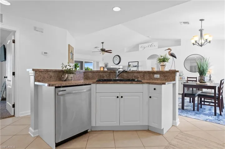 Kitchen island with sink and dishwasher