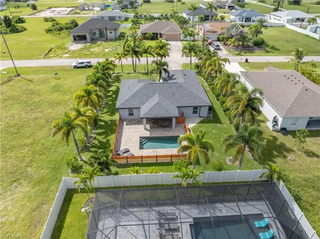 Palms surround this gorgeous pool home