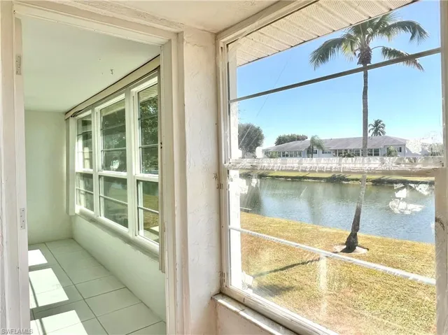 sunroom with a water view