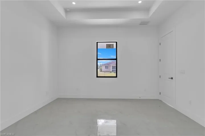 Spare room with a tray ceiling
