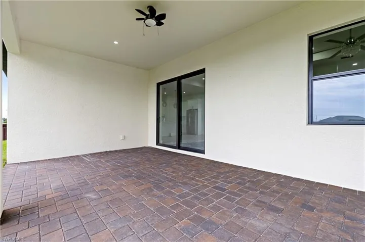 View of patio with a ceiling fan
