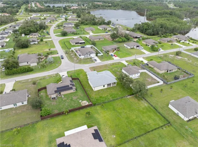 Aerial view of property's location featuring nearby suburban area