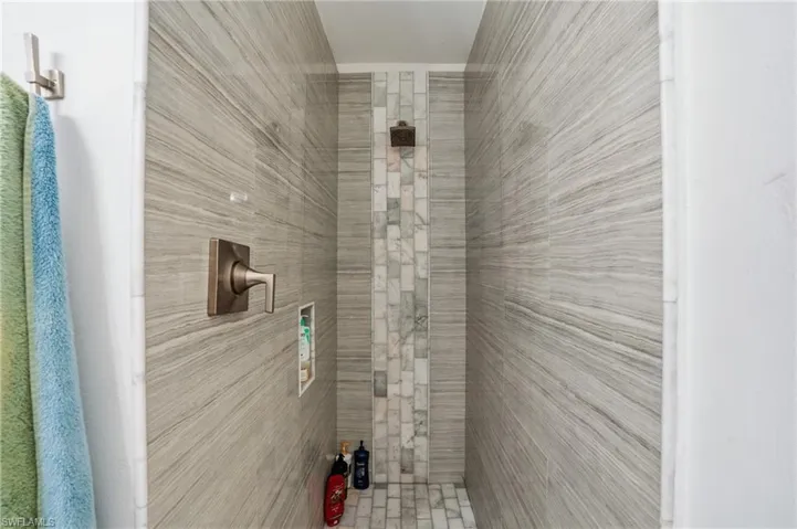 Bathroom featuring tiled shower