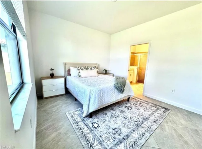 Bedroom featuring ensuite bath