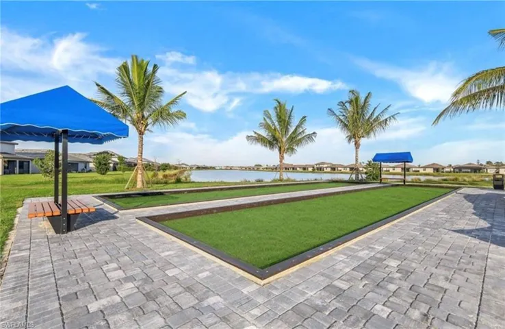 View of community with a bocce ball area, a water view