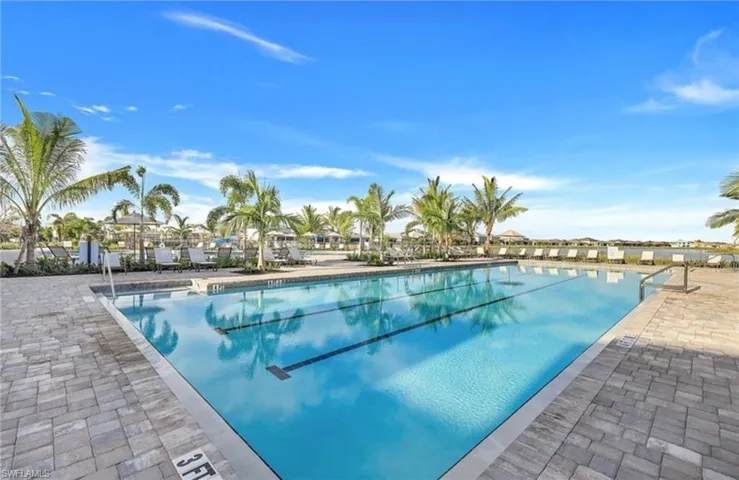Community pool with a patio