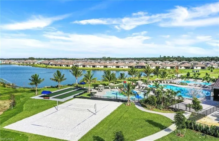 View of home's community featuring volleyball court, a swimming pool