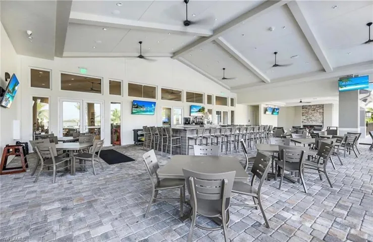 Dining space with light stone finish floors