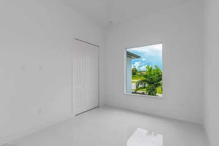 Empty room featuring tile flooring