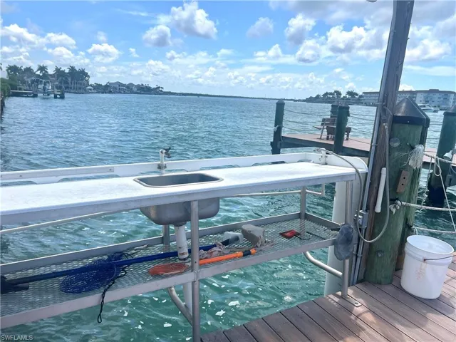 Waterfront pier featuring 2 built-in l sinks with plenty of counter space