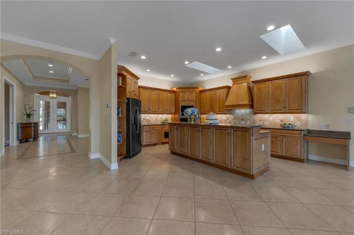 Looking from family room to the dining room, front foyer, and three bedrooms.