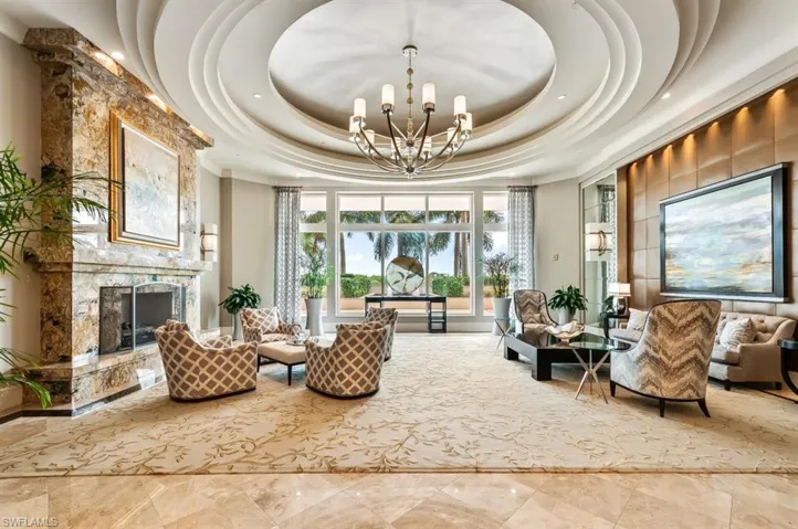 Community lobby featuring a high tray ceiling