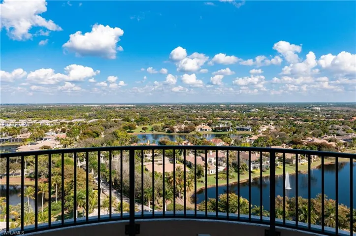 Balcony with a water view and a residential view