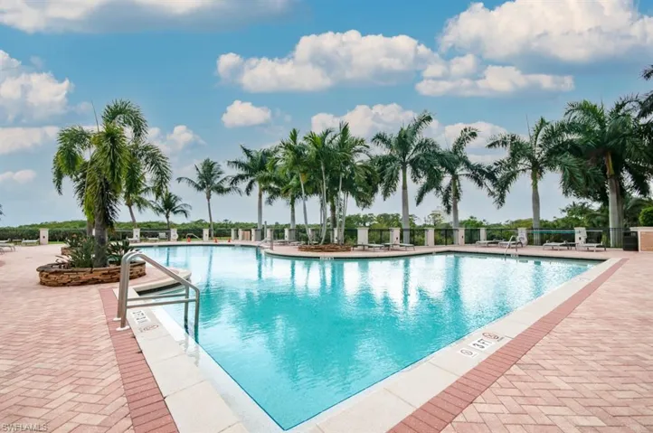 Community pool with a patio area