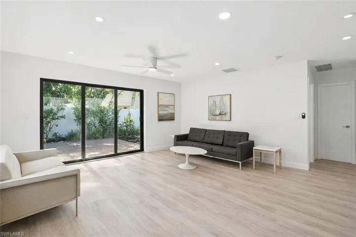 Living area featuring recessed lighting, light wood finished floors, and ceiling fan