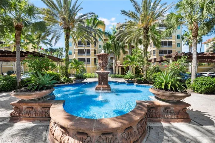 Community pool featuring a patio