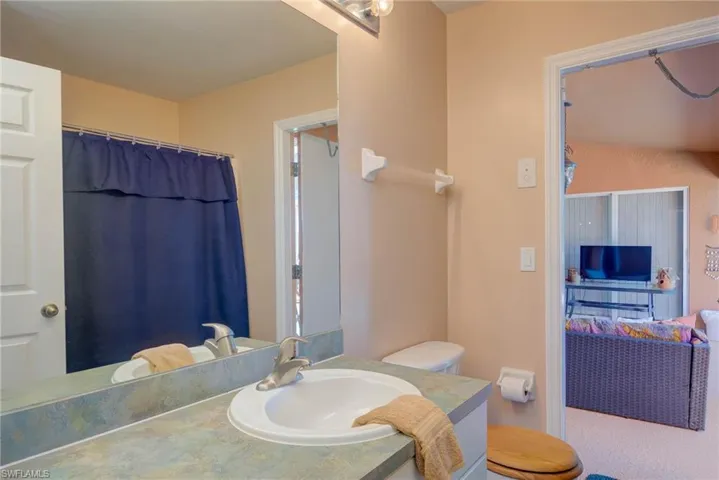 Full bath with toilet and vanity