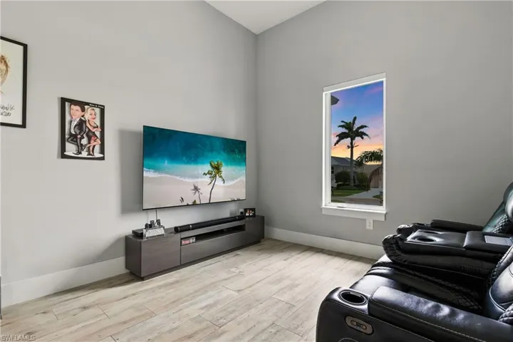 Living area featuring light wood-style flooring and baseboards
