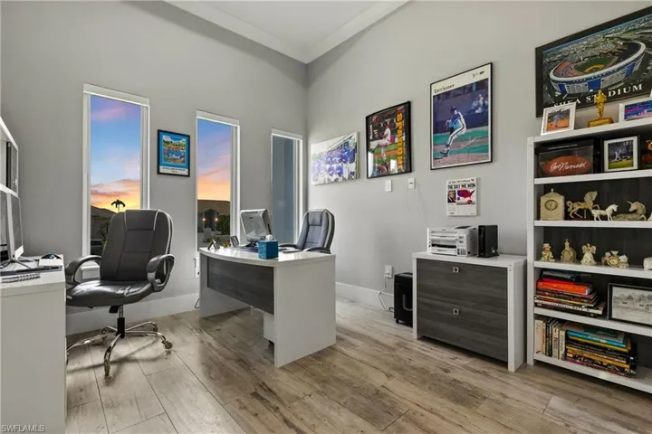 Office with wood finished floors and ornamental molding