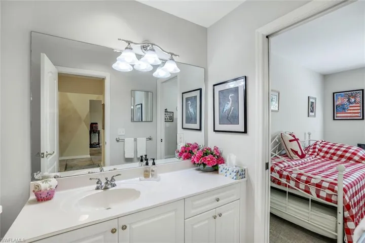 Ensuite bathroom with connected bathroom and vanity