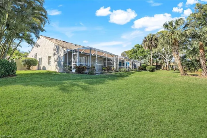 View of yard with a lanai