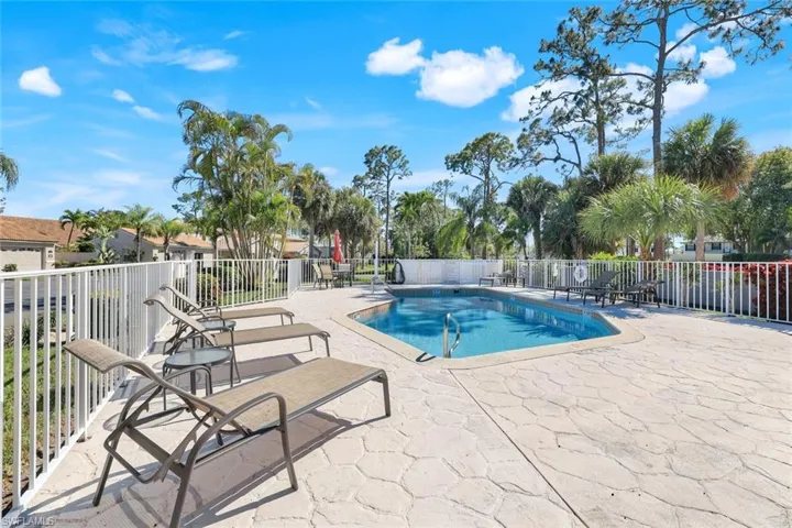 Pool featuring fence and a patio