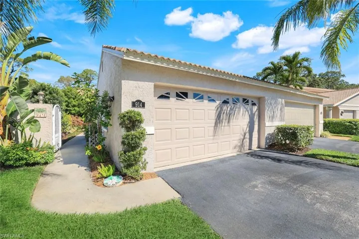 Garage featuring aphalt driveway